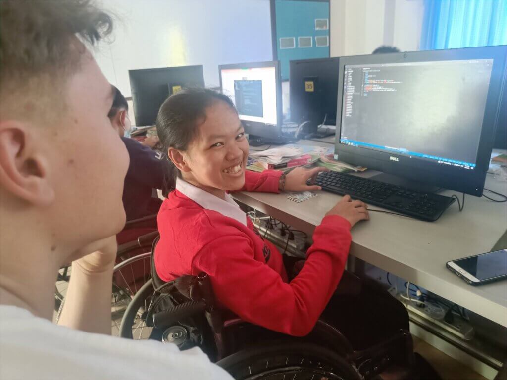 An disabled girl learning to programing code